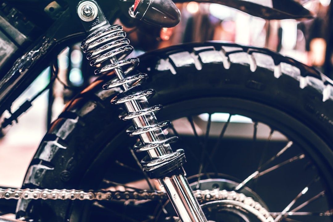 Close-up of a motorcycle rear shock absorber and tire